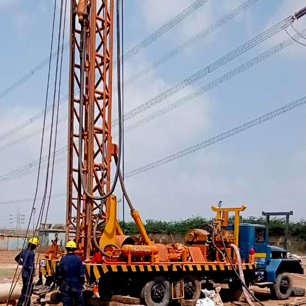 alt="Beautician shaping a client's eyebrows using threading technique in a salon"
